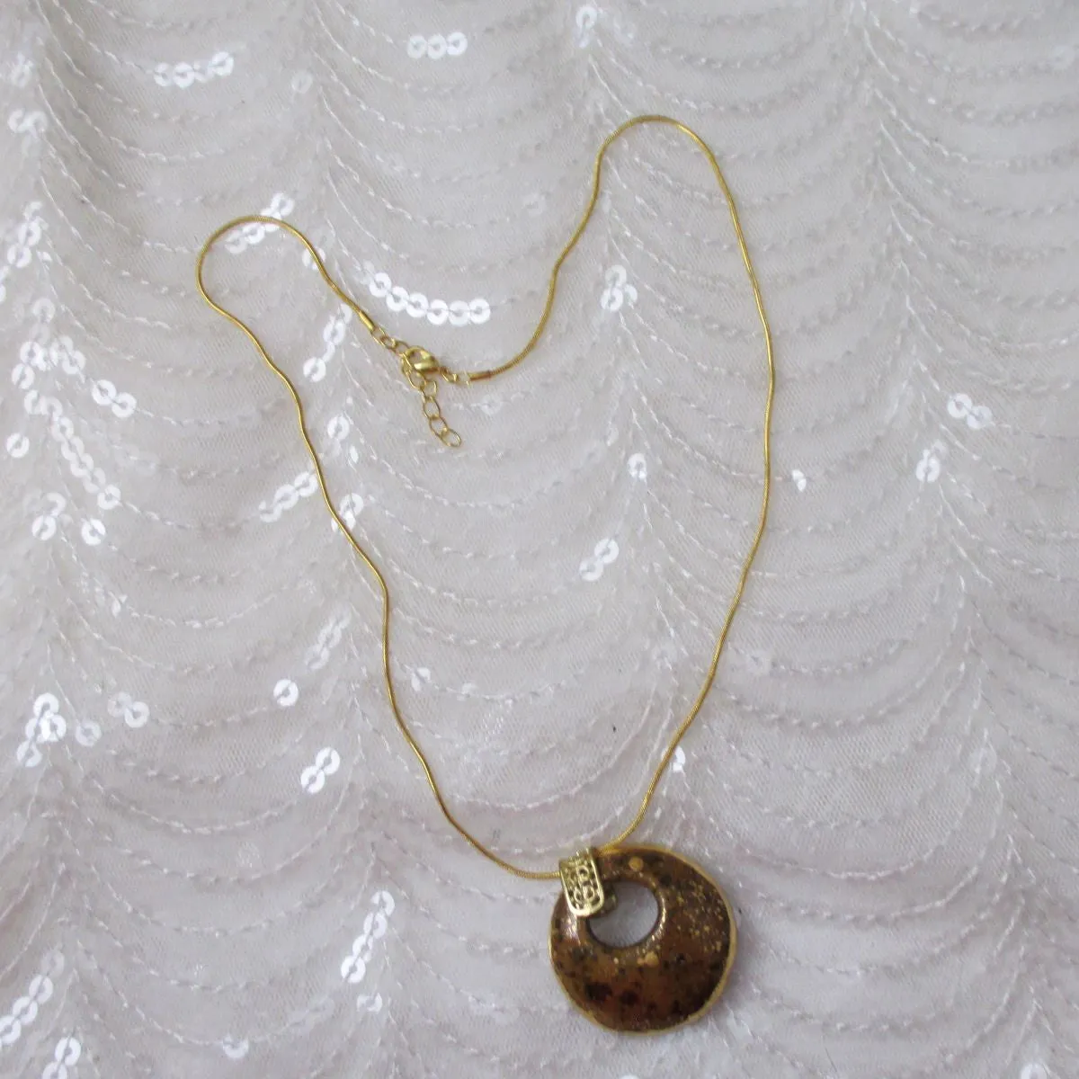 Golden Brown and Gold Kazuri Pendant on Gold Chain