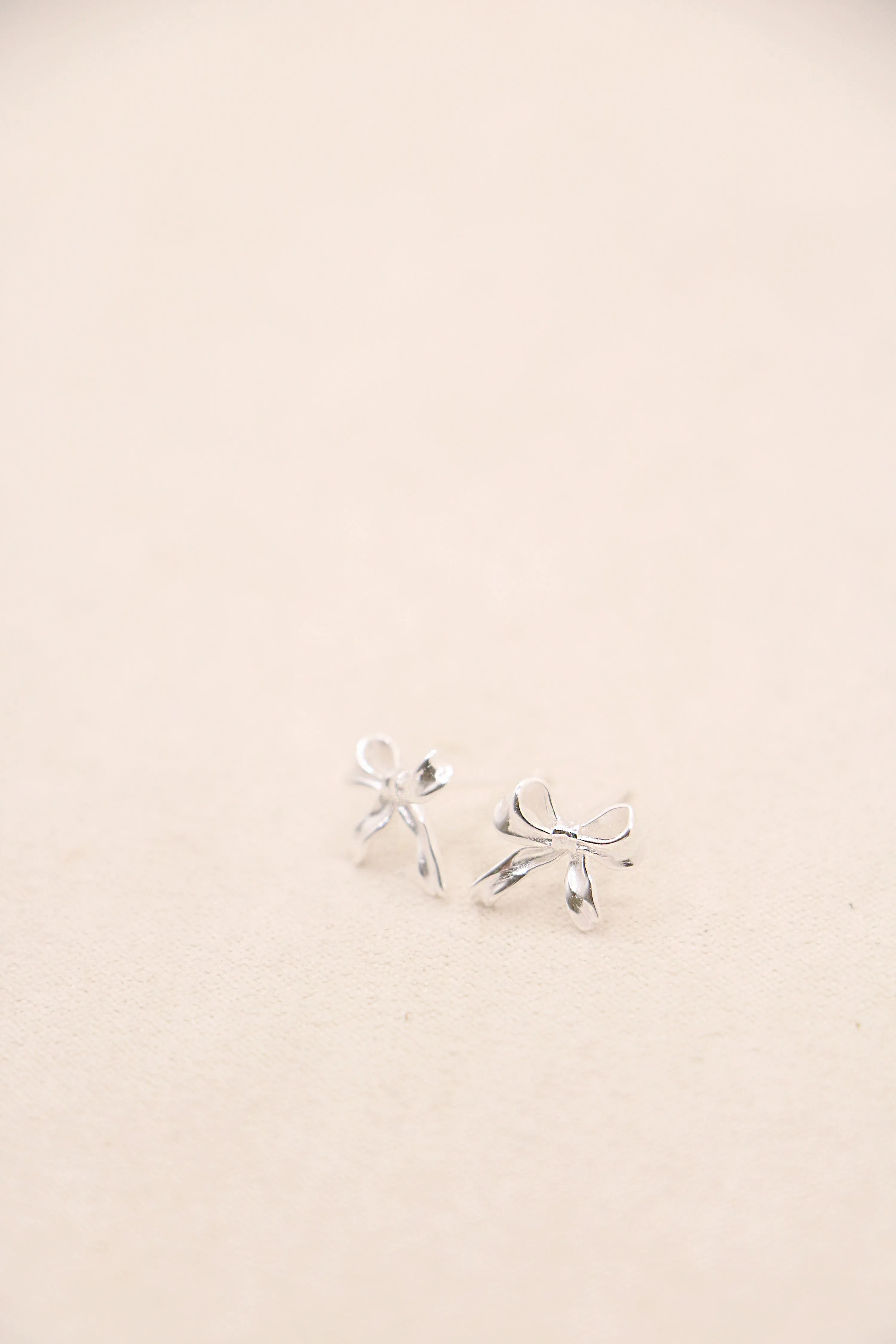 tiny bow studs { silver   gold }